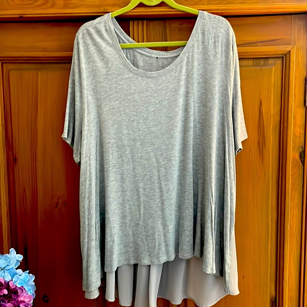 Stretch fancy T-shirt w/ crepe on bottom of the back for coverage.